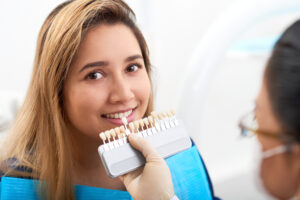 A woman getting assessed by a dentist for veneers