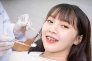 A woman receiving braces treatment at a dental clinic